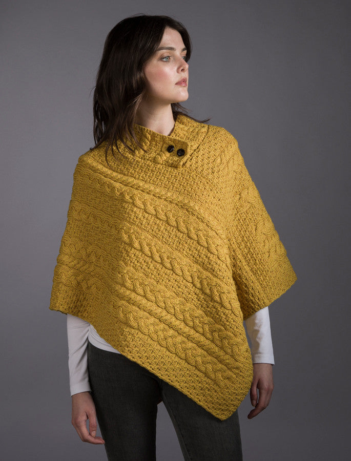 CABLE ARAN PONCHO WITH BUTTON DETAIL